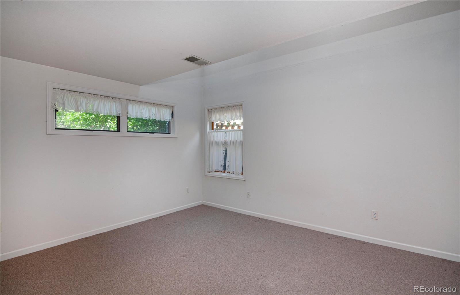 609 Pleasant Street Boulder, CO 80302 - Photo 18 of 28 an empty room with windows