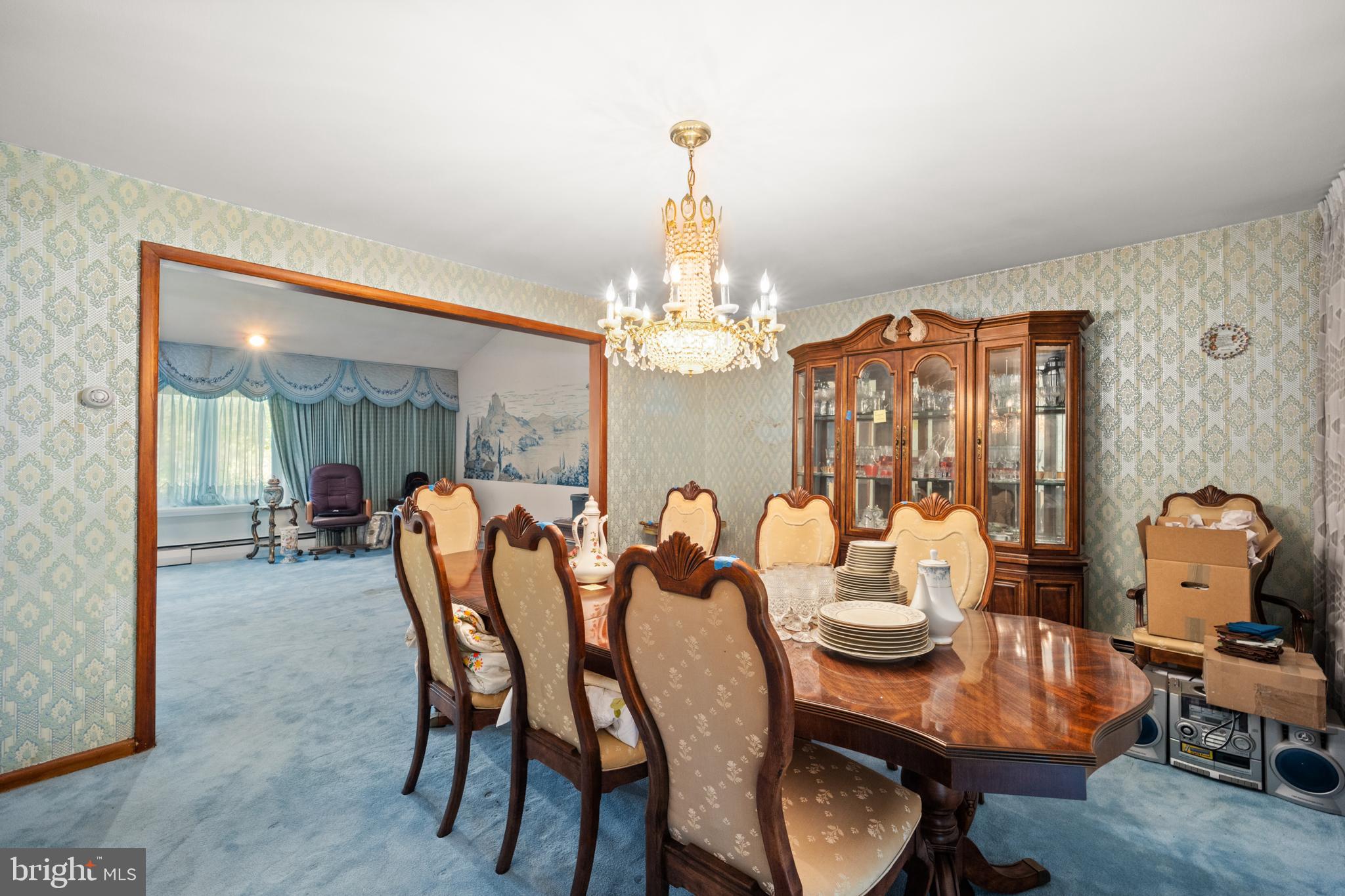 417 Gribbel Road Wyncote, PA 19095 - Photo 12 of 44 a dining room with furniture a chandelier and window