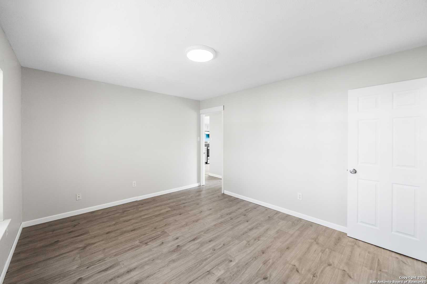8010 Chestnut Gate Drive Converse, TX 78109 - Photo 17 of 37 a view of an empty room and wooden floor