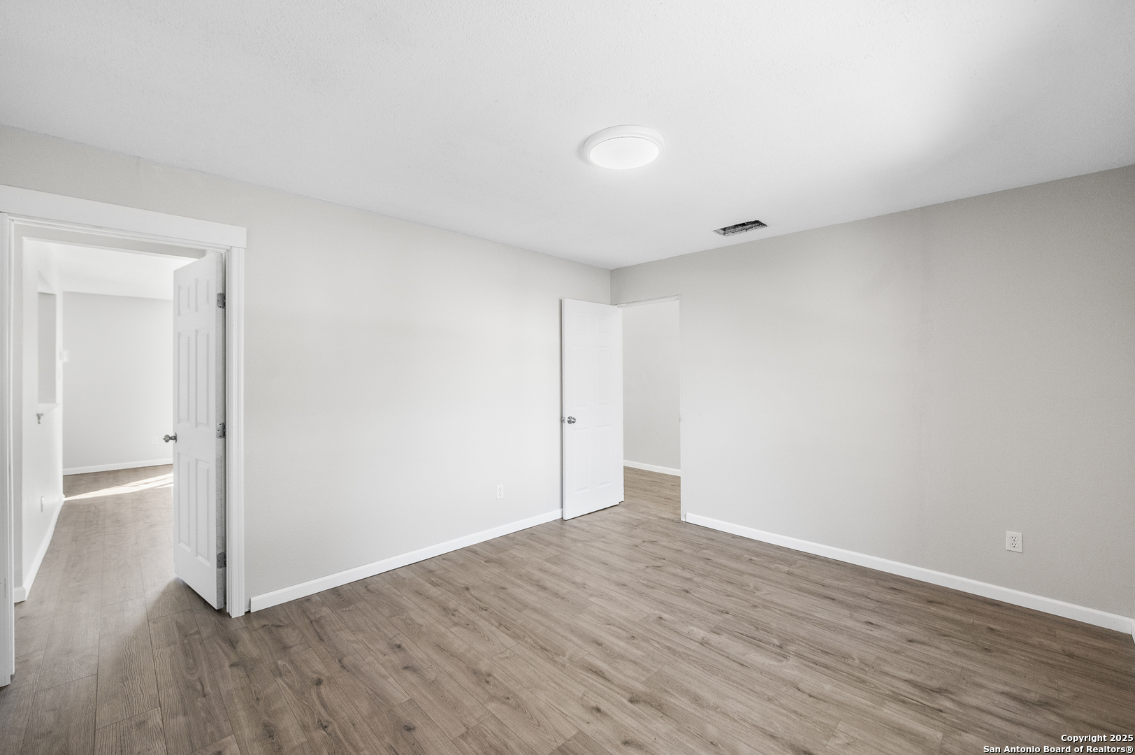 8010 Chestnut Gate Drive Converse, TX 78109 - Photo 18 of 37 a view of an empty room with wooden floor