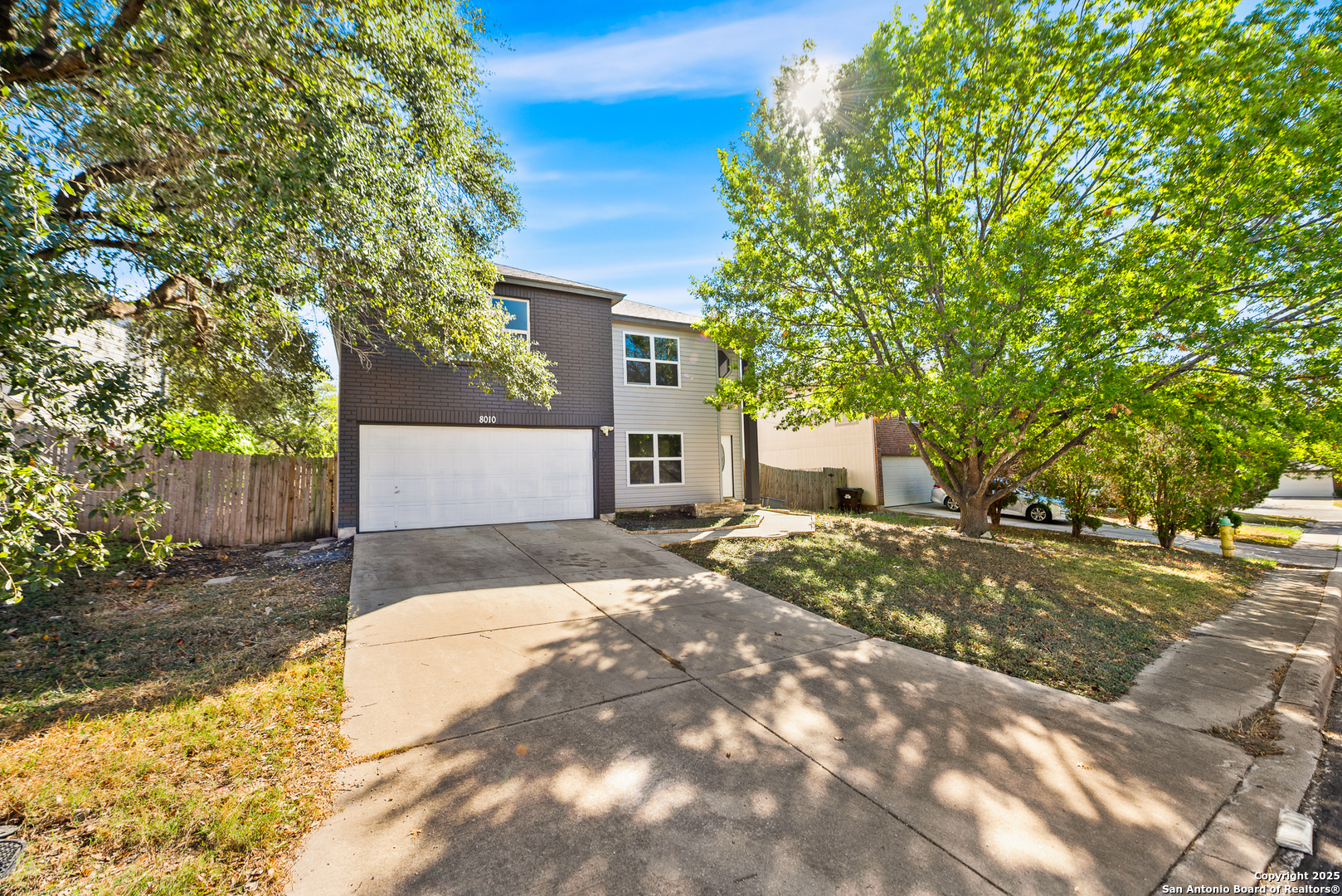 8010 Chestnut Gate Drive Converse, TX 78109 - Photo 2 of 37 a front view of a house with a yard and garage