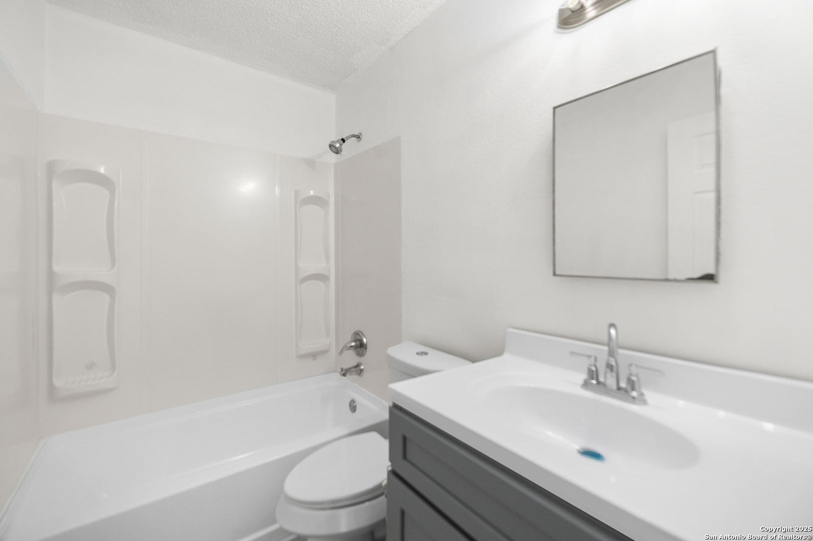 8010 Chestnut Gate Drive Converse, TX 78109 - Photo 26 of 37 a bathroom with a sink toilet and shower
