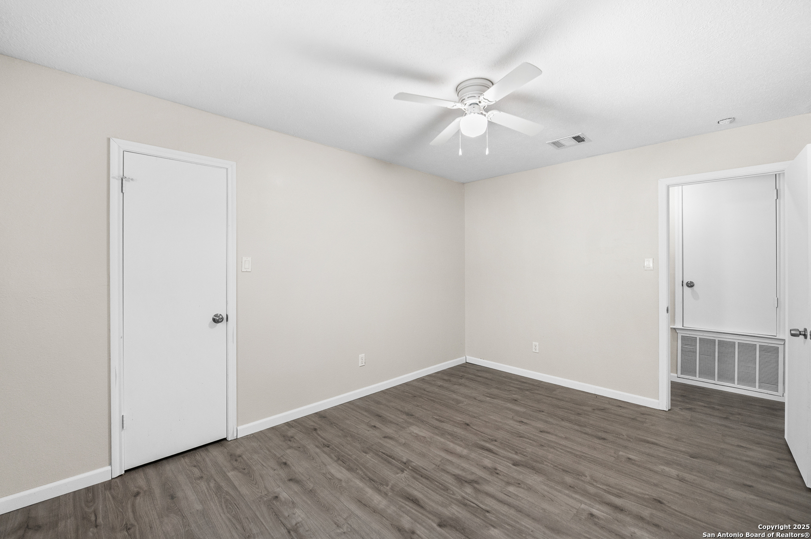 8010 Chestnut Gate Drive Converse, TX 78109 - Photo 27 of 37 a view of an empty room with wooden floor