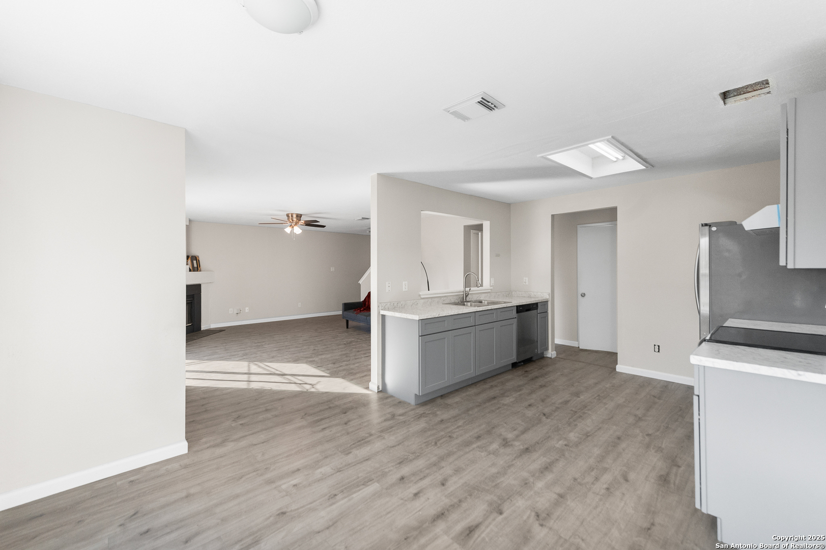 8010 Chestnut Gate Drive Converse, TX 78109 - Photo 10 of 37 a view of a kitchen with a sink and dishwasher in kitchen