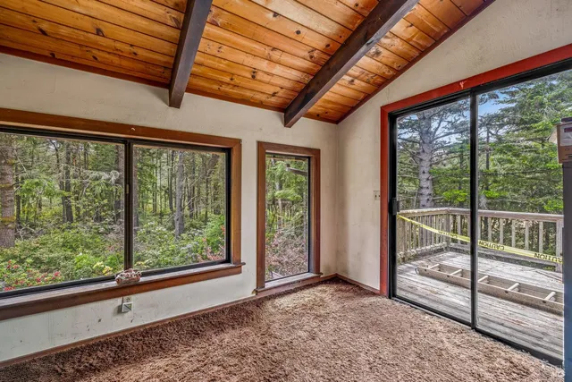 a view of a room with wooden floor and walls