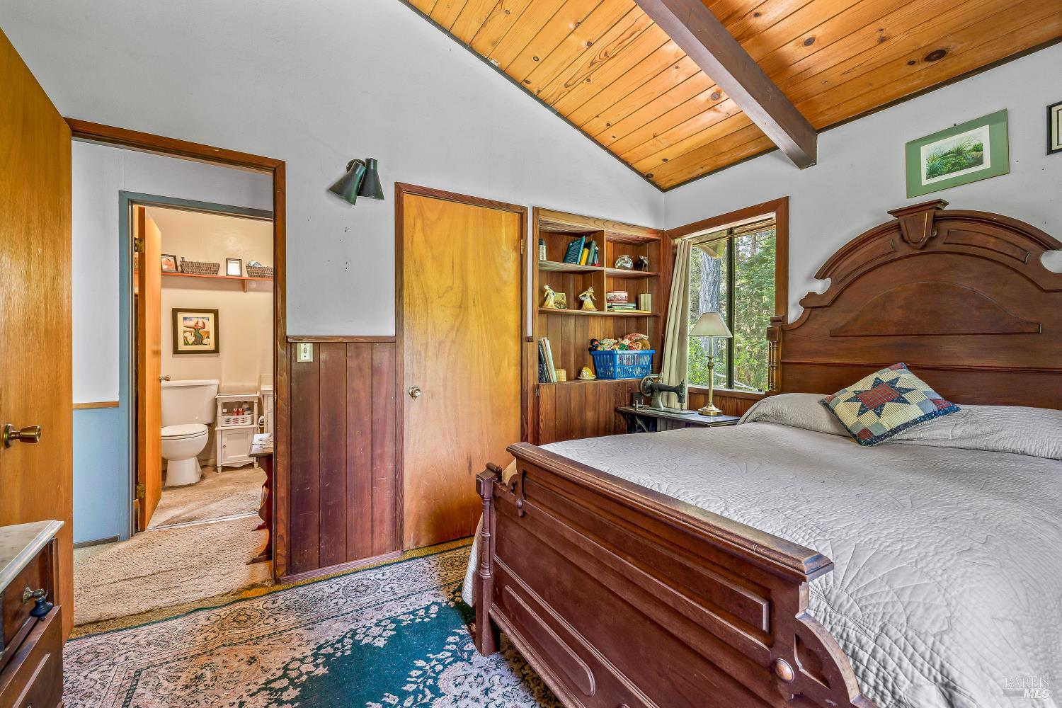 43150 Little Lake Road Mendocino, CA 95460 - Photo 17 of 27 a bedroom with a bed and a dresser next to a window
