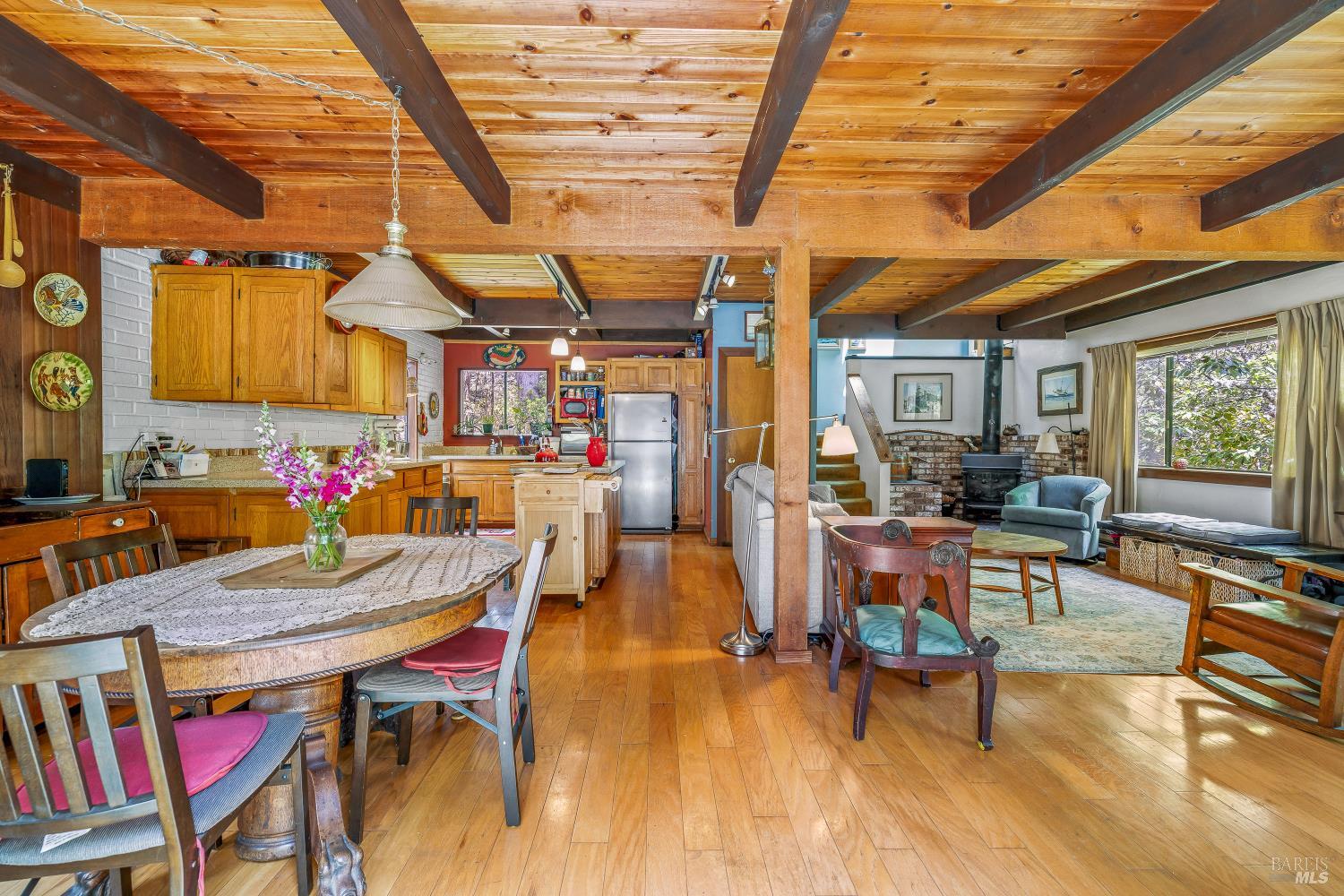 43150 Little Lake Road Mendocino, CA 95460 - Photo 6 of 27 a outdoor dining space with furniture and wooden floor