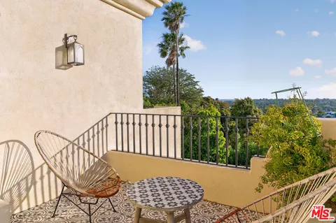 a view of a balcony with an outdoor space