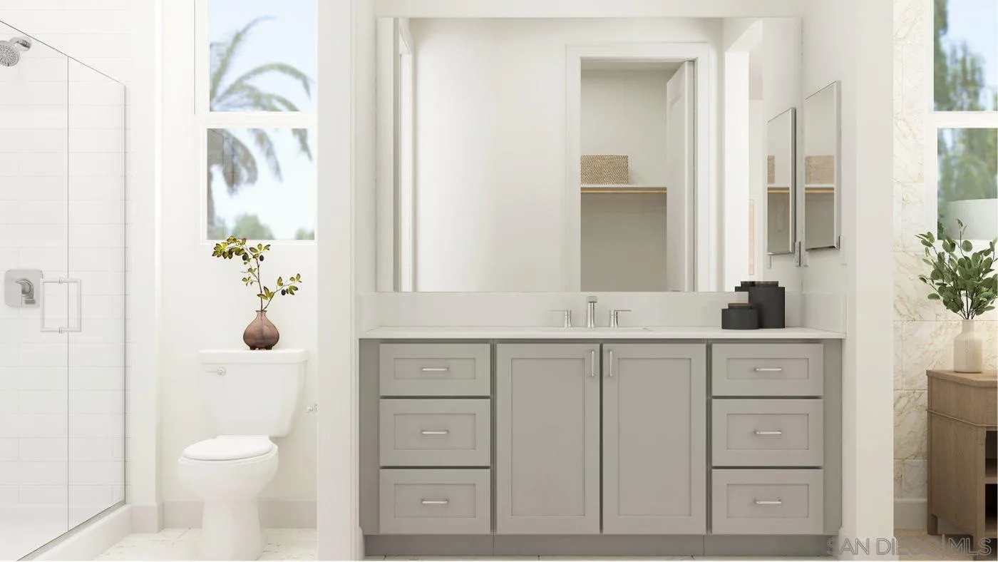 17451 Abbey Road Poway, CA 92064 - Photo 18 of 30 a bathroom with a granite countertop sink toilet and shower