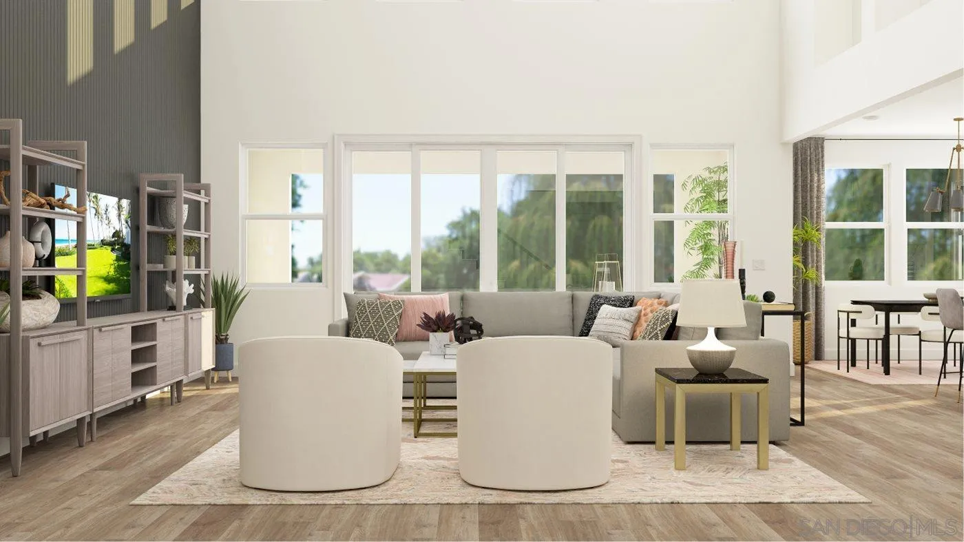 17451 Abbey Road Poway, CA 92064 - Photo 4 of 30 a living room with furniture a flat screen tv and floor to ceiling windows