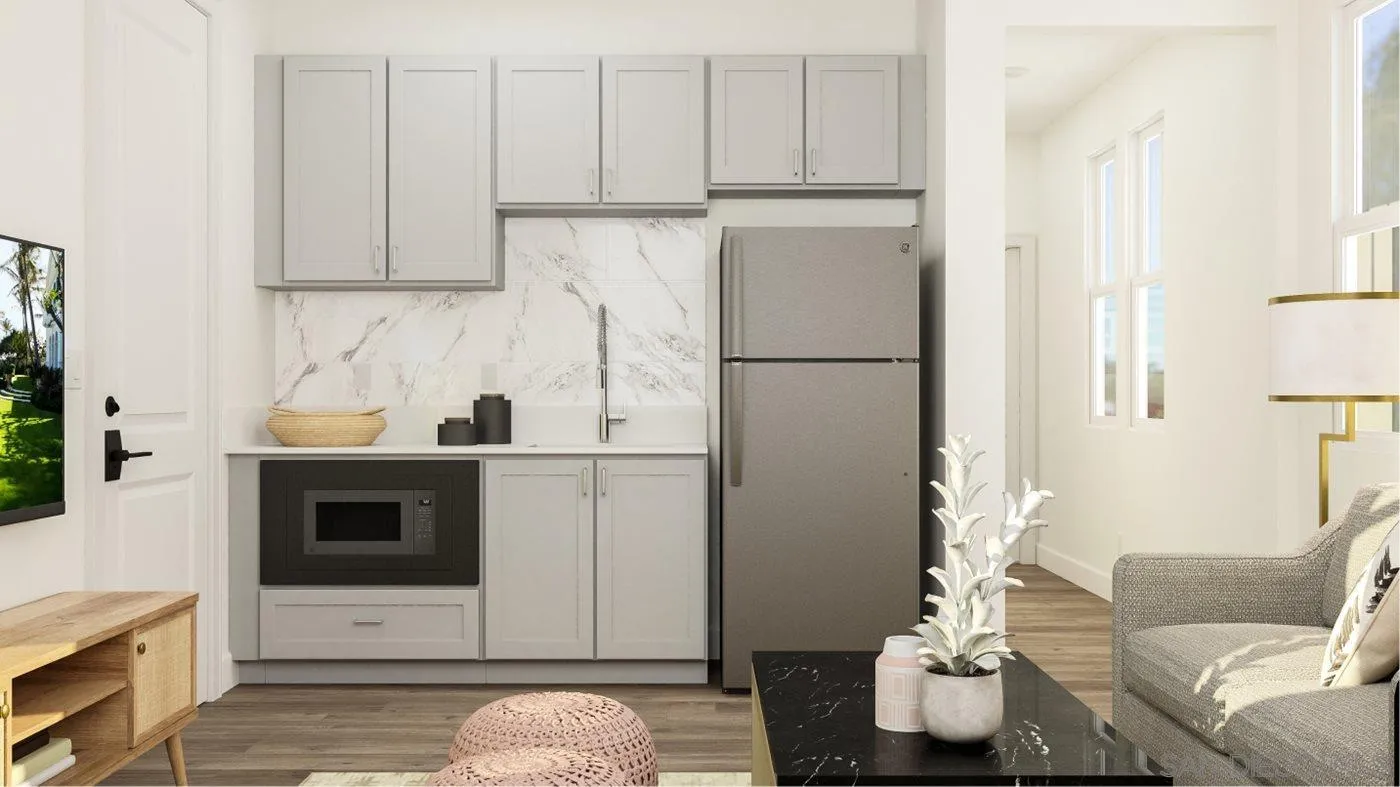 17451 Abbey Road Poway, CA 92064 - Photo 10 of 30 a kitchen with stainless steel appliances granite countertop a refrigerator sink and white cabinets