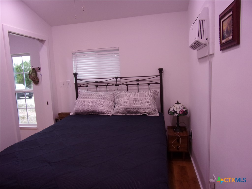 2471 Rolling River View Spring Branch, TX 78070 - Photo 16 of 23 a bed room with a bed and a window