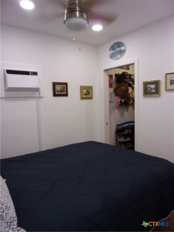 2471 Rolling River View Spring Branch, TX 78070 - Photo 17 of 23 a view of a livingroom with wooden floor and a ceiling fan