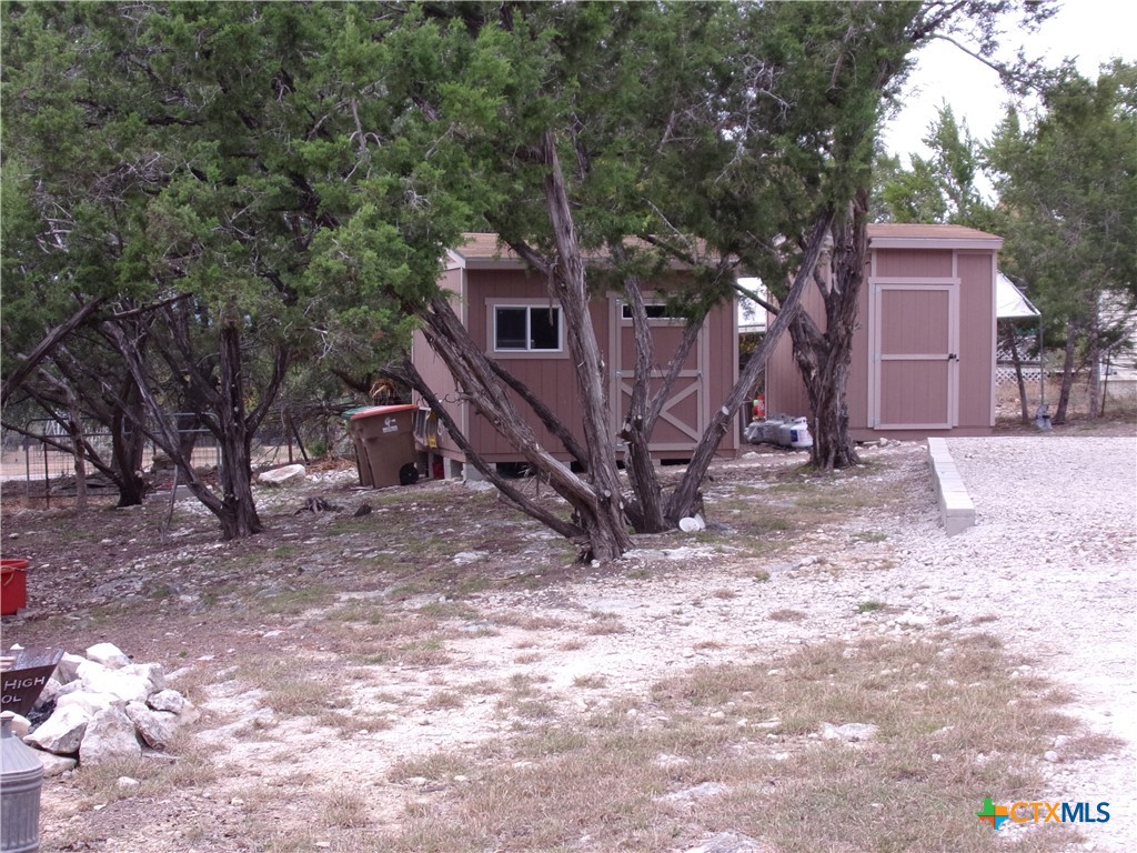 2471 Rolling River View Spring Branch, TX 78070 - Photo 19 of 23 a view of a house with a yard