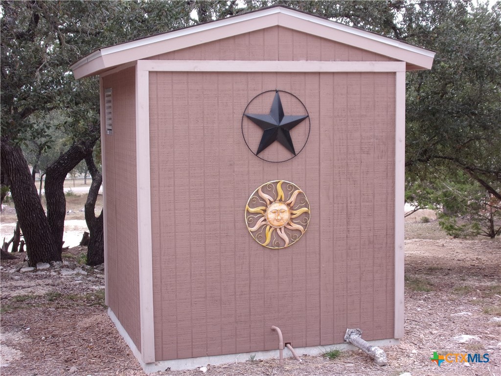 2471 Rolling River View Spring Branch, TX 78070 - Photo 6 of 23 a front view of a house with garden