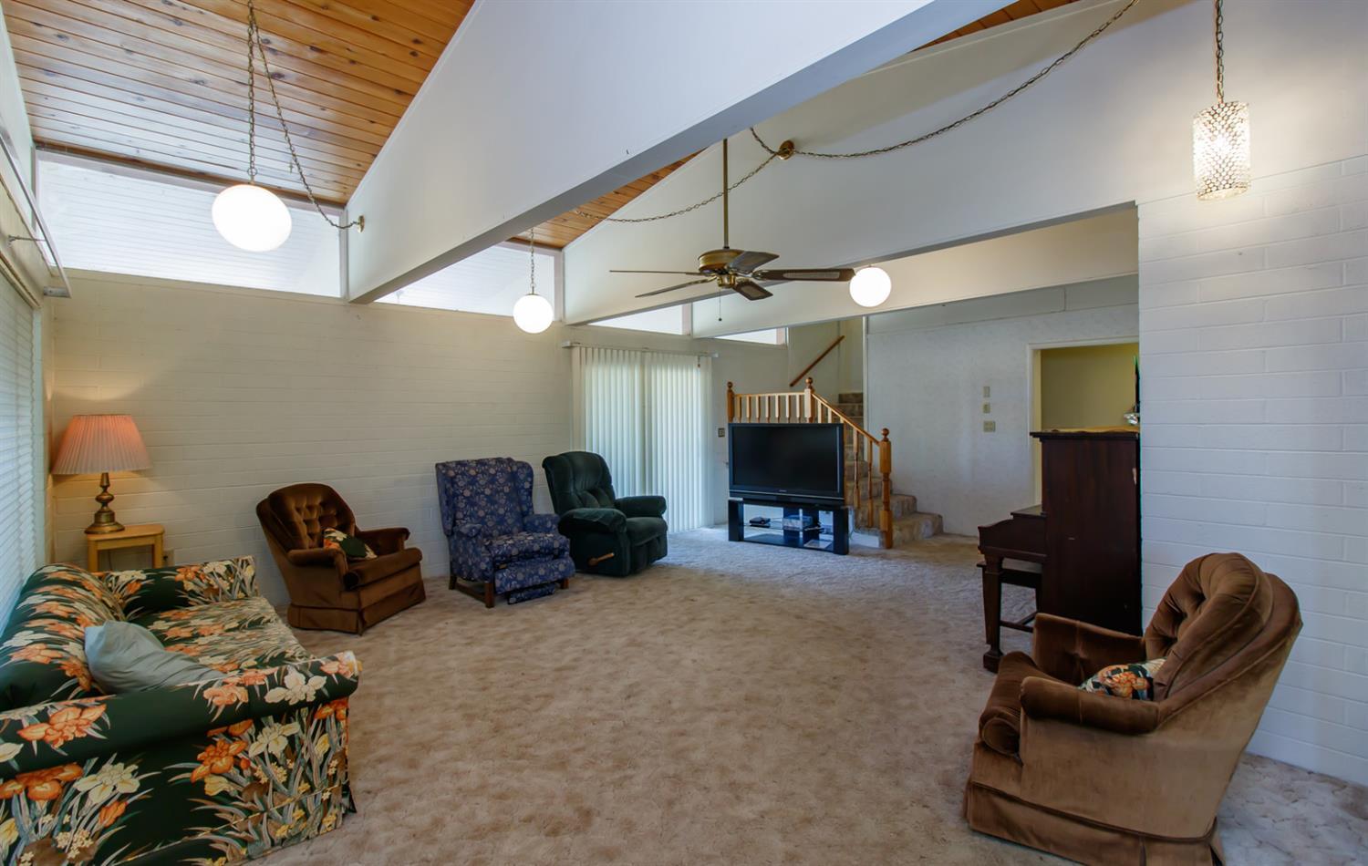 1039 West Valley View Road Ashland, OR 97520 - Photo 4 of 32 a room with furniture and a ceiling fan