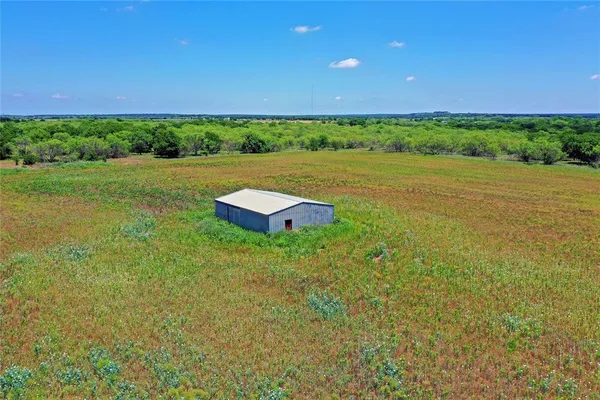 a view of a lake with a yard