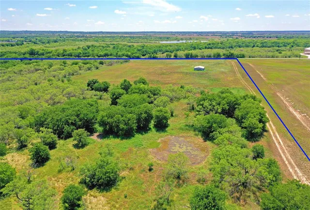 a view of a lake with a big yard