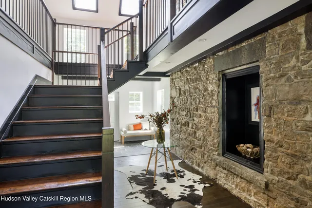 a view of entryway with wooden floor