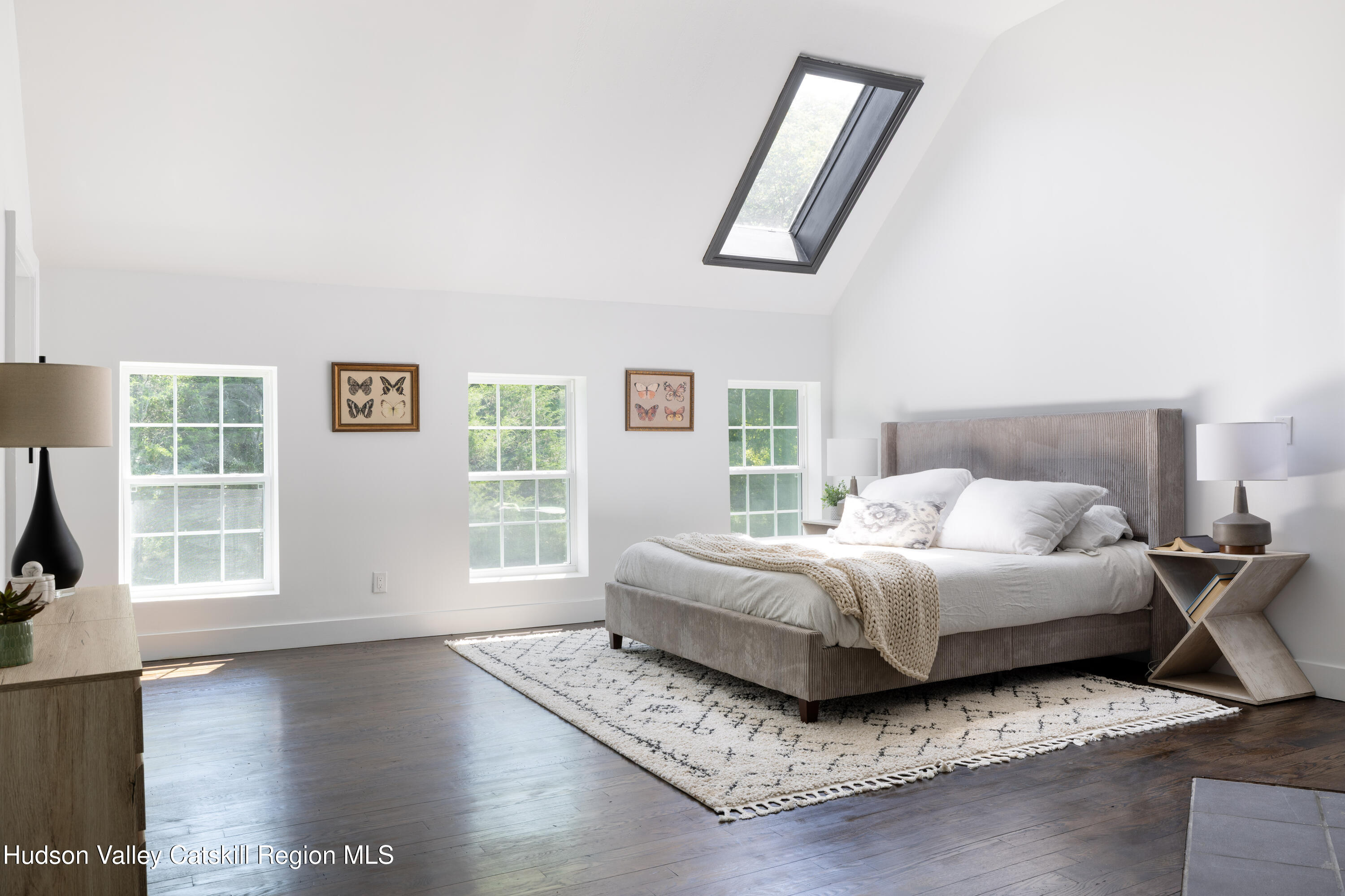 2733 Highway 209 Kingston, NY 12401 - Photo 28 of 52 a spacious bedroom with a bed a couch and a window