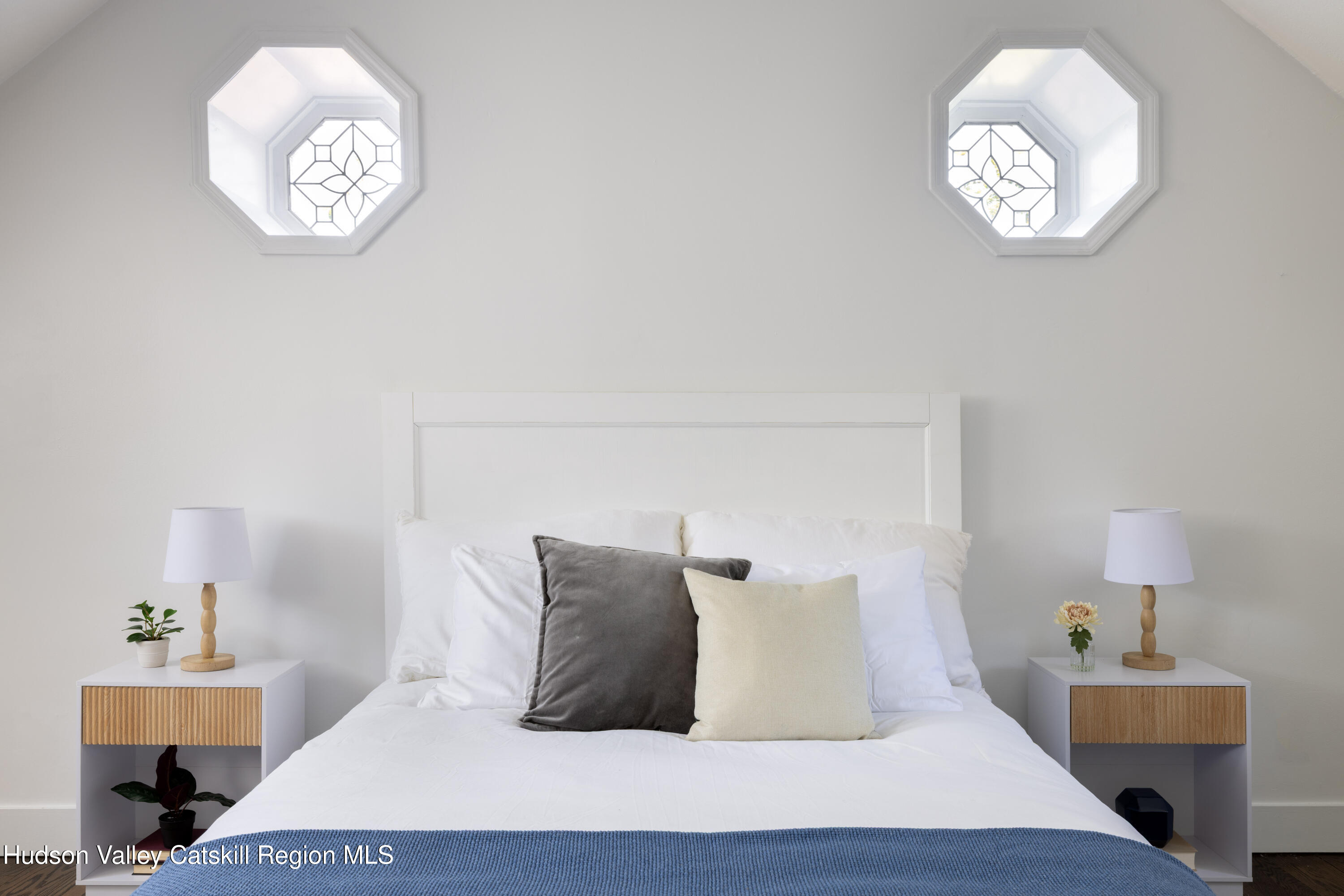 2733 Highway 209 Kingston, NY 12401 - Photo 35 of 52 a bed sitting in a bedroom next to a window with a chandelier