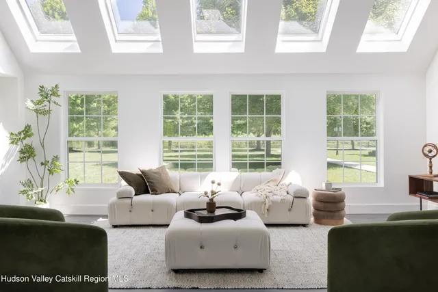 a living room with furniture and windows