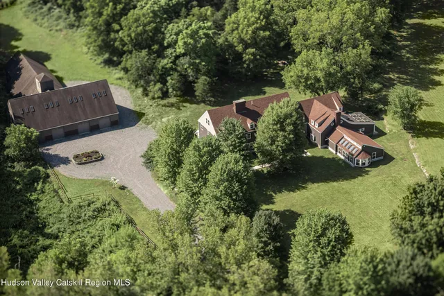 an aerial view of house with yard swimming pool and outdoor seating