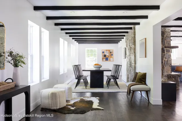 a dining room with furniture and wooden floor