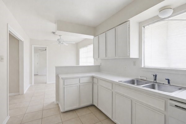 1655 Hawthorne Street Houston, TX 77006 - Photo 36 of 39 a kitchen with a sink cabinets and window