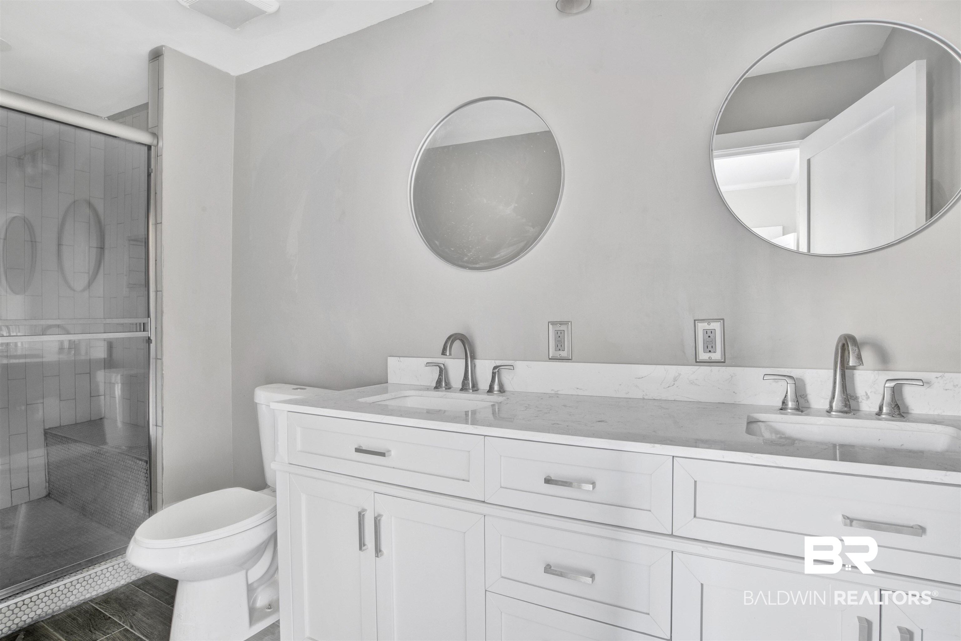 1063 Selma Street Mobile, AL 36604 - Photo 16 of 32 Full bath with double vanity, a stall shower, and wood finish floors