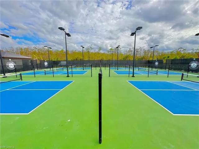 a view of a playground and basketball court