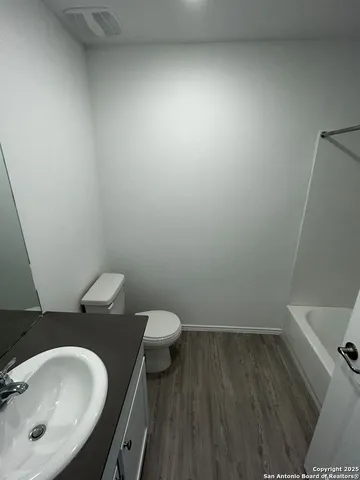 a bathroom with a sink and a toilet