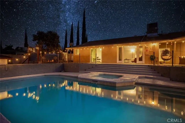 a kitchen with stainless steel appliances granite countertop a sink and a stove
