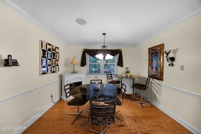 a living room with furniture window and wooden floor