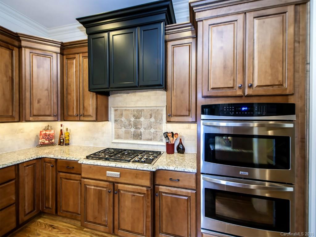 262 Horton Grove Road Fort Mill, SC 29715 - Photo 11 of 24 a kitchen with granite countertop cabinets and steel stainless steel appliances