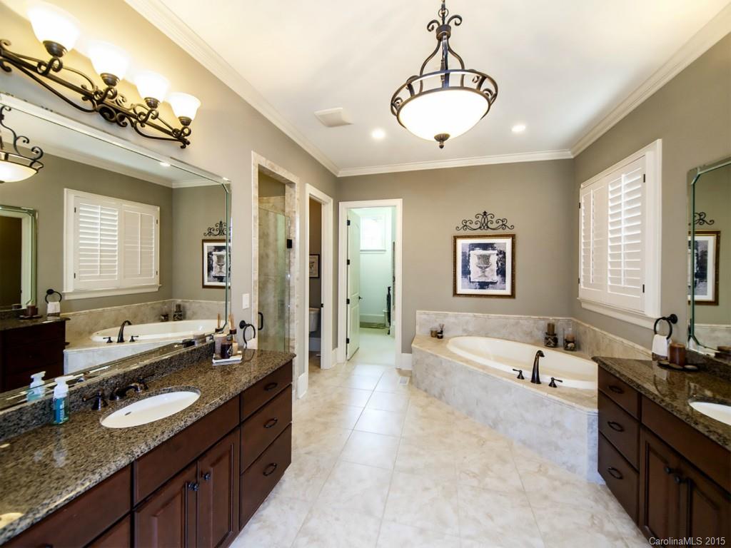 262 Horton Grove Road Fort Mill, SC 29715 - Photo 14 of 24 a large spacious bathroom with a double vanity sink large mirror and a shower