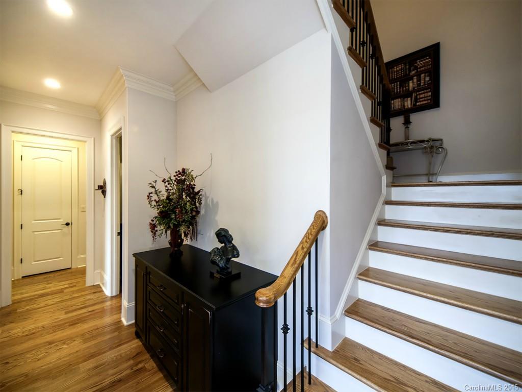 262 Horton Grove Road Fort Mill, SC 29715 - Photo 16 of 24 a view of a hallway with wooden floor and staircase
