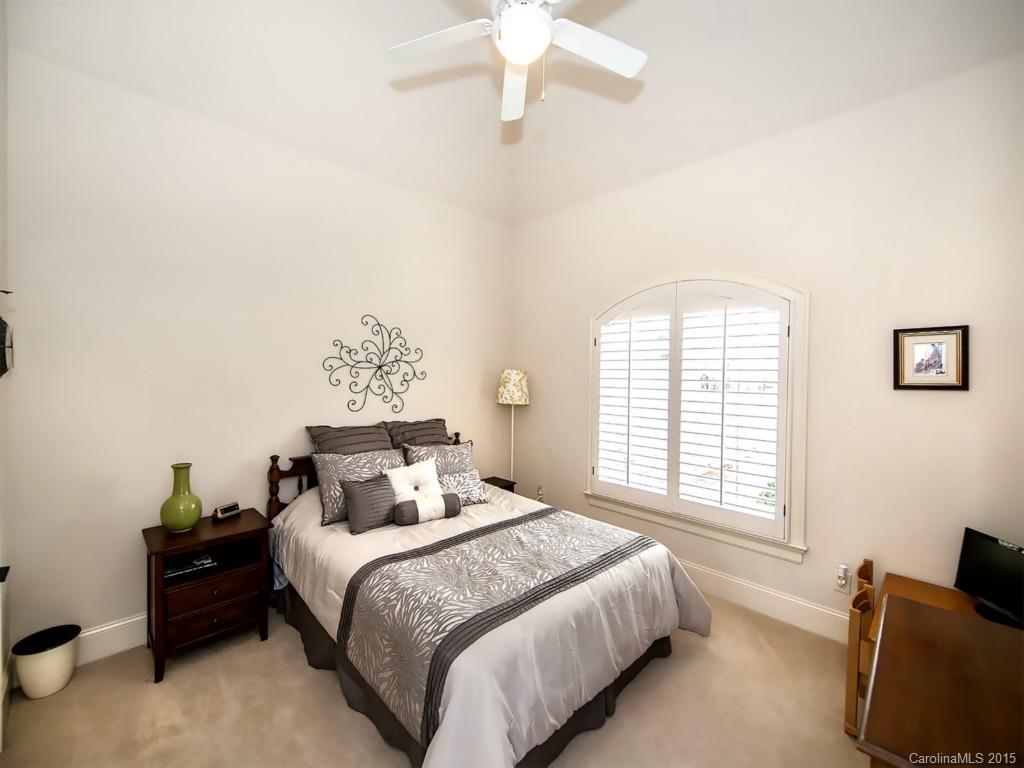 262 Horton Grove Road Fort Mill, SC 29715 - Photo 19 of 24 a bedroom with a bed and wooden floor