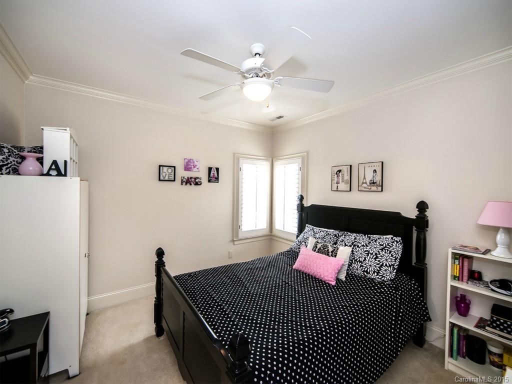 262 Horton Grove Road Fort Mill, SC 29715 - Photo 20 of 24 a bedroom with a bed and a book shelf