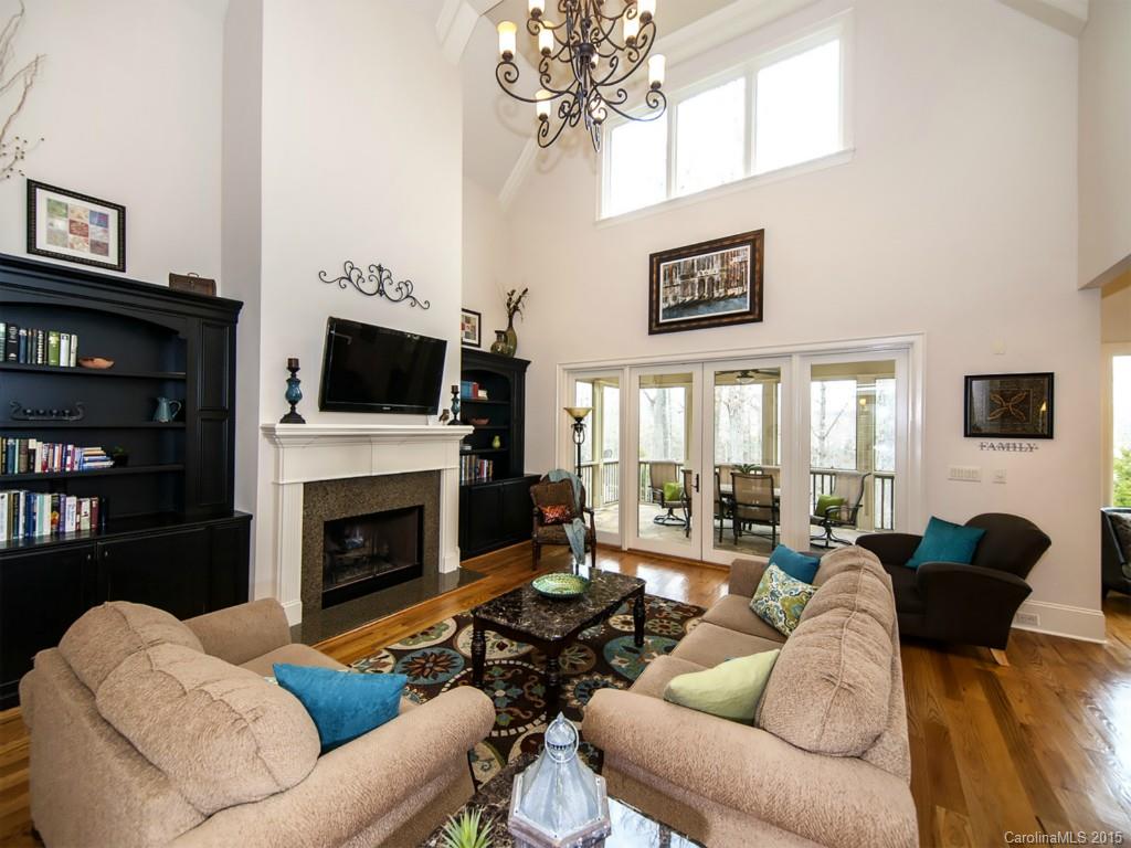 262 Horton Grove Road Fort Mill, SC 29715 - Photo 5 of 24 a living room with furniture a fireplace and a flat screen tv