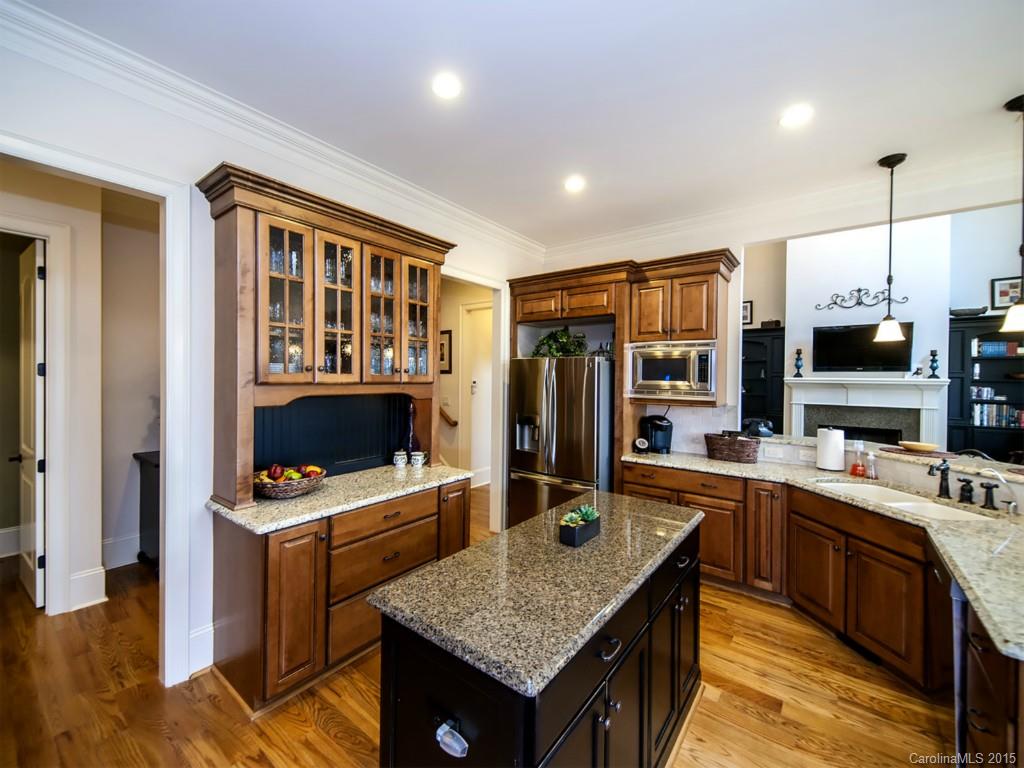 262 Horton Grove Road Fort Mill, SC 29715 - Photo 10 of 24 a kitchen that has a lot of cabinets in it and wooden floors