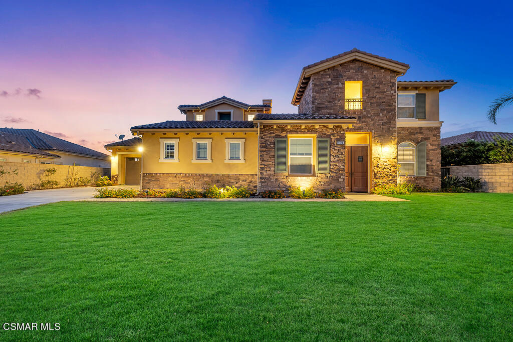 7379 Nicklaus Road Moorpark, CA 93021 - Photo 1 of 85 a front view of a house with a yard