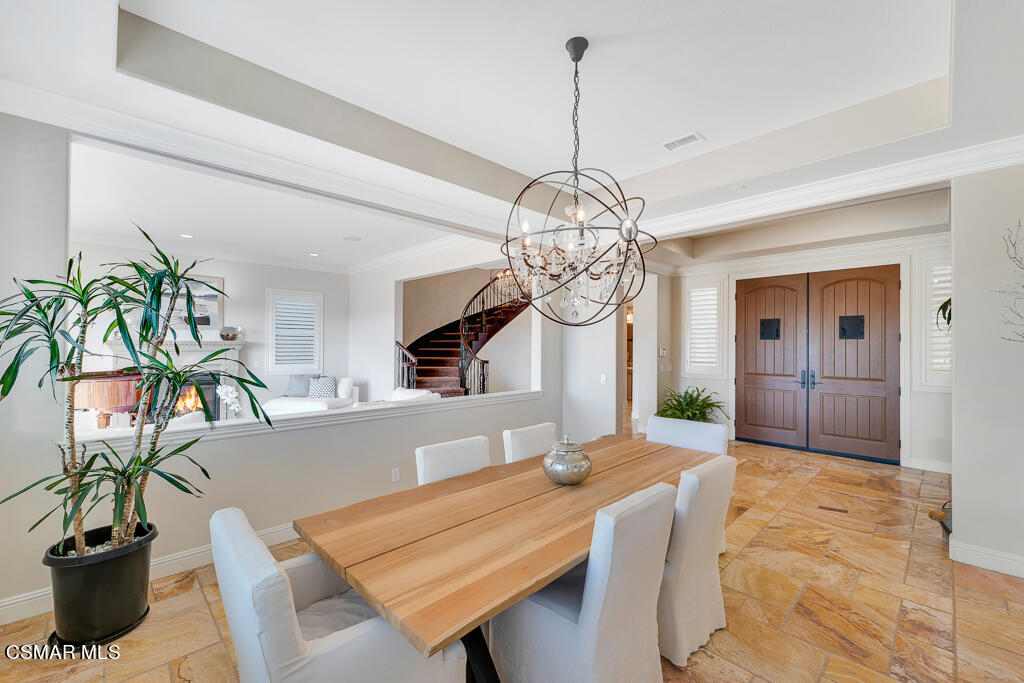 7379 Nicklaus Road Moorpark, CA 93021 - Photo 11 of 85 a view of a dining room with furniture wooden floor and chandelier