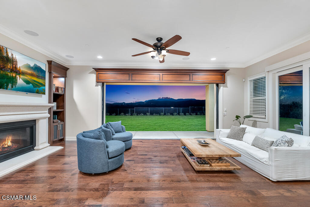 7379 Nicklaus Road Moorpark, CA 93021 - Photo 22 of 85 a living room with fireplace furniture and a flat screen tv