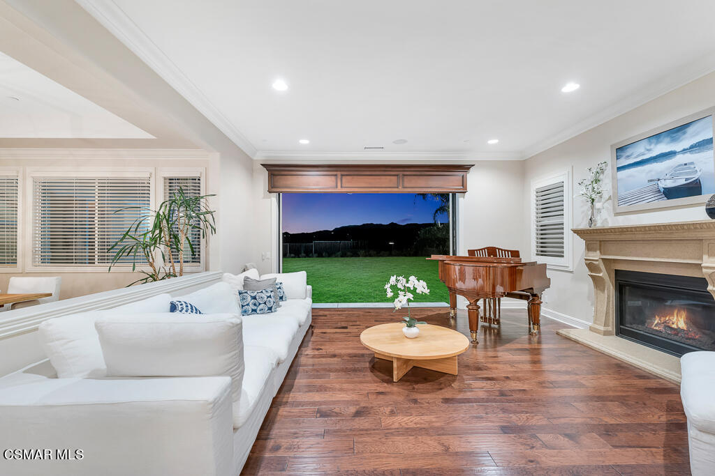 7379 Nicklaus Road Moorpark, CA 93021 - Photo 25 of 85 a living room with furniture and a fireplace