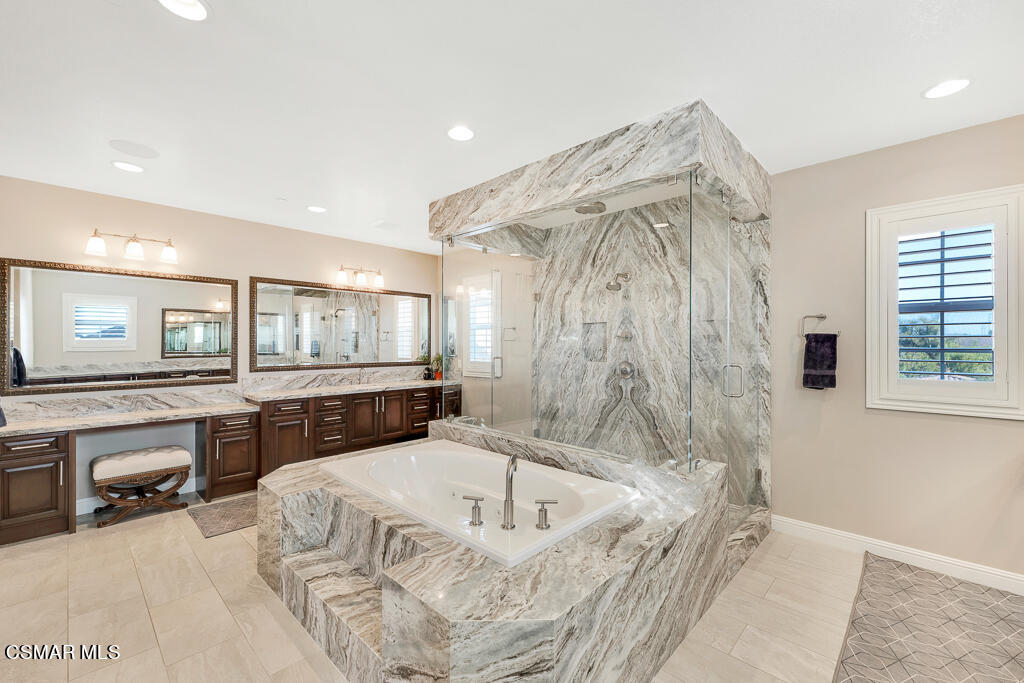 7379 Nicklaus Road Moorpark, CA 93021 - Photo 51 of 85 a bathroom with a bathtub and a shower