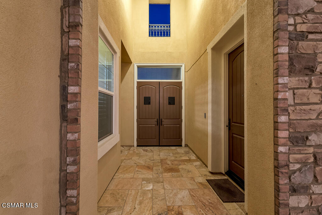 7379 Nicklaus Road Moorpark, CA 93021 - Photo 6 of 85 a view of a hallway with a door and wooden door