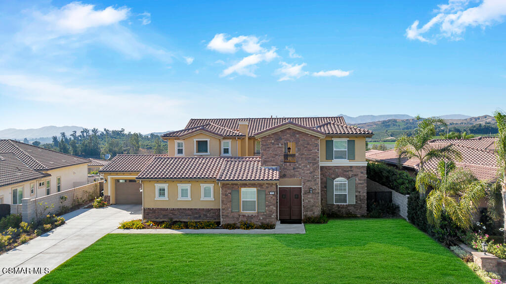 7379 Nicklaus Road Moorpark, CA 93021 - Photo 67 of 85 a front view of a house with a garden