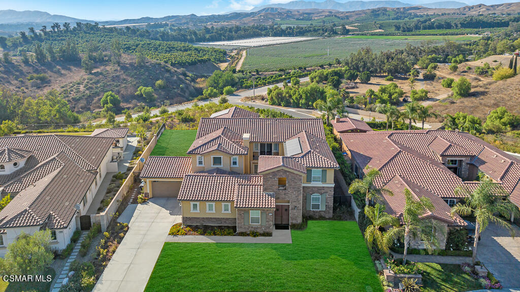 7379 Nicklaus Road Moorpark, CA 93021 - Photo 69 of 85 an aerial view of a house with a garden and lake view