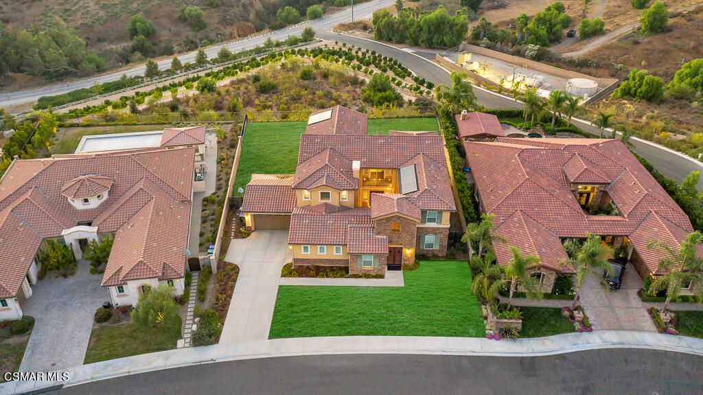 7379 Nicklaus Road Moorpark, CA 93021 - Photo 75 of 85 an aerial view of a house with a garden and plants